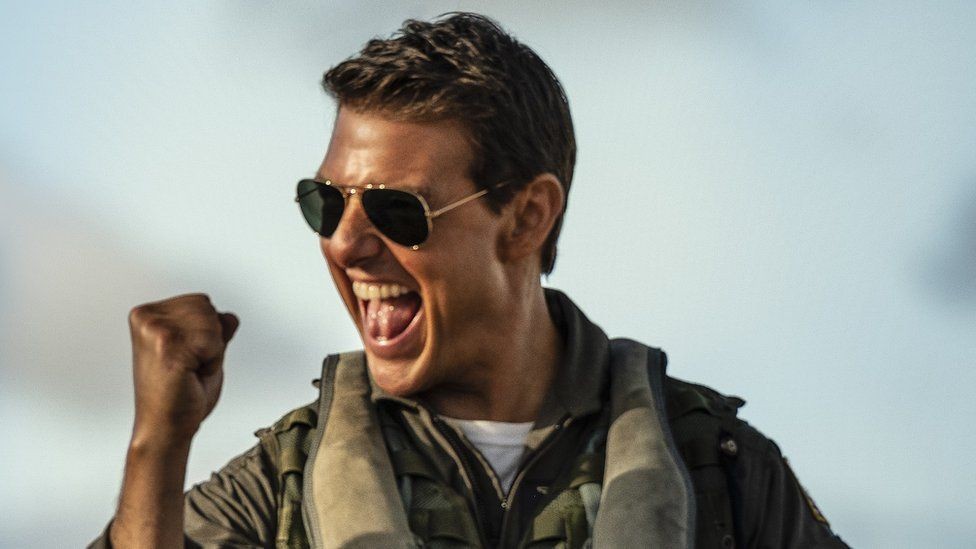 Tom Cruise holding fist in the air