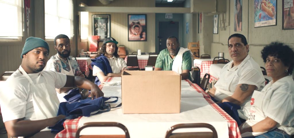 The kitchen staff sitting at a table together